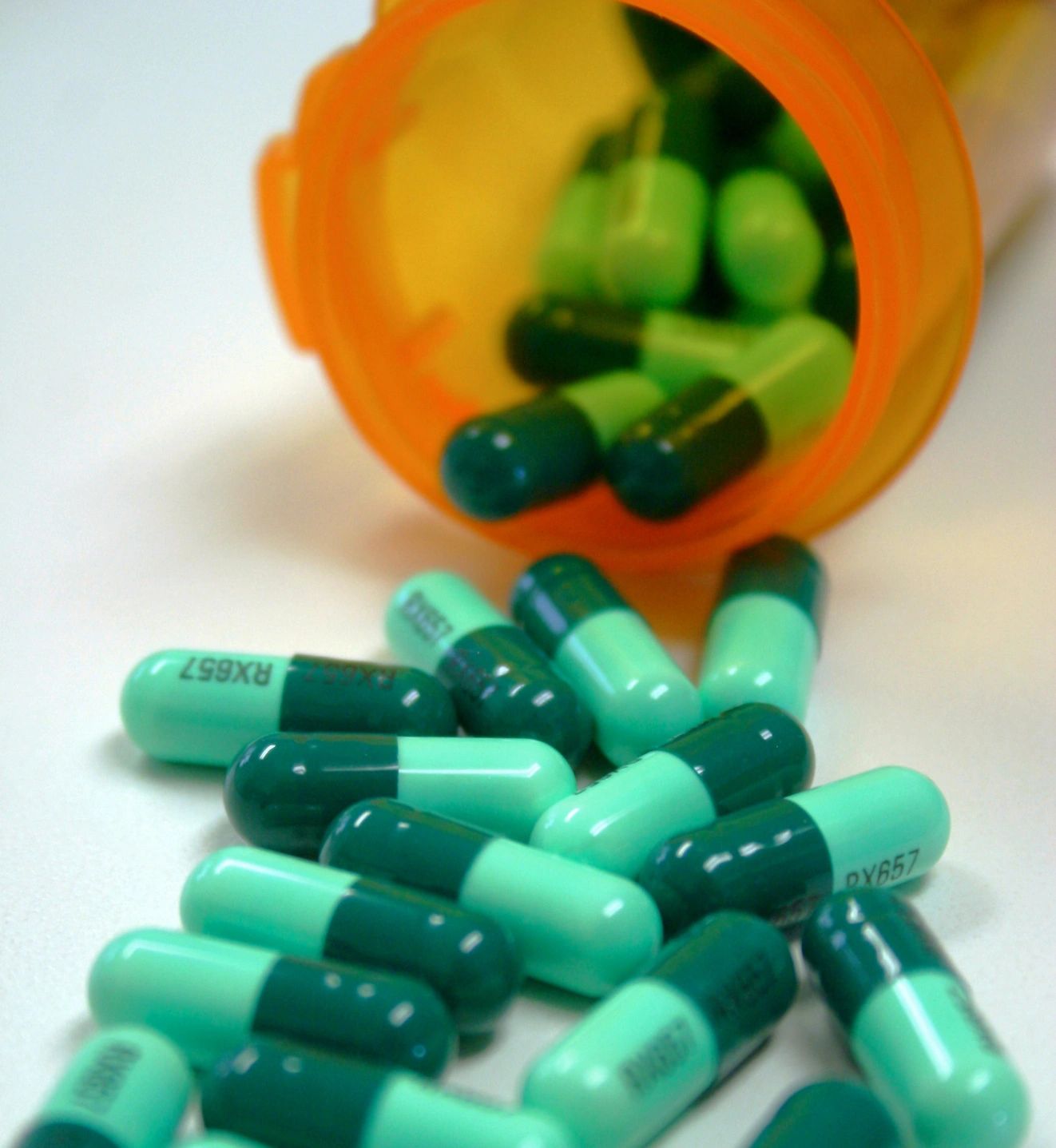 prescription pill bottle spilling capsules